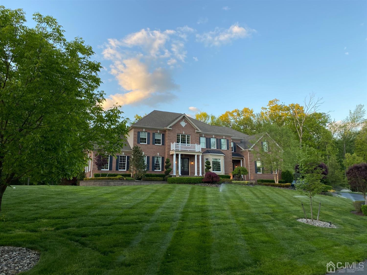 12 Horseshoe Court Monroe Township, NJ 08831 - Photo 2 of 81 a front view of a house with a garden