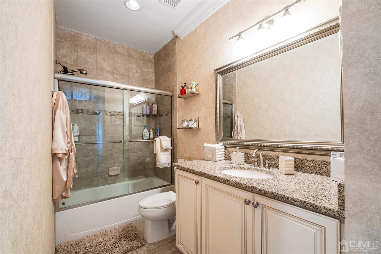 12 Horseshoe Court Monroe Township, NJ 08831 - Photo 23 of 81 a bathroom with a granite countertop sink toilet and shower