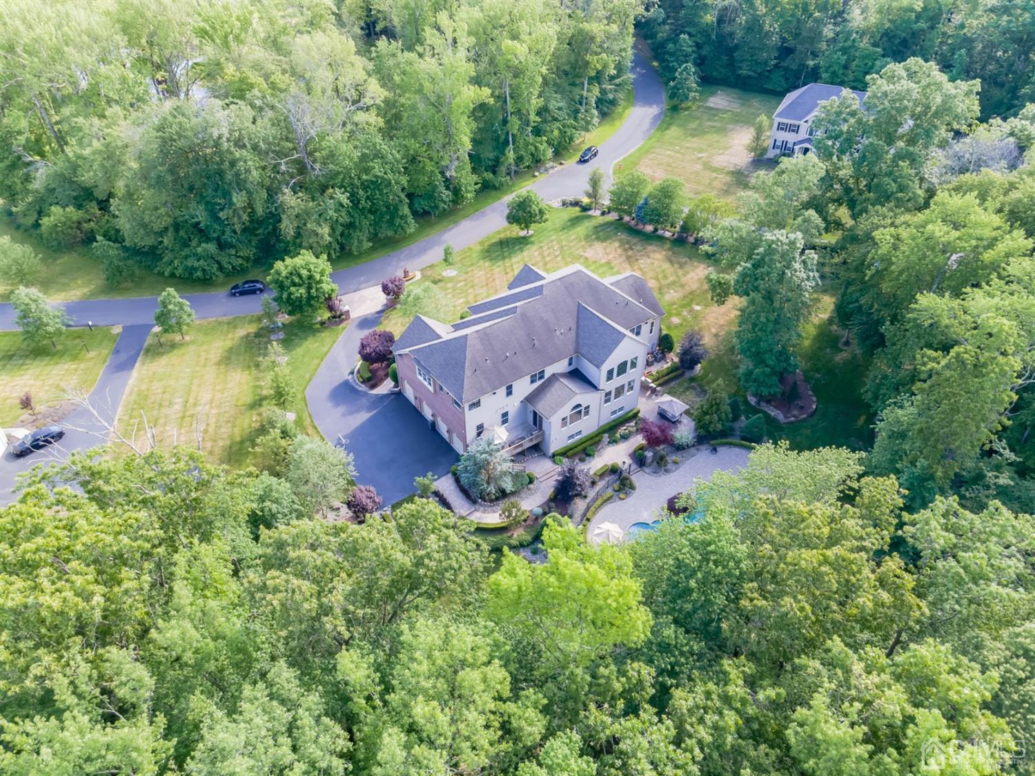 12 Horseshoe Court Monroe Township, NJ 08831 - Photo 35 of 81 an aerial view of a house with a garden and swimming pool