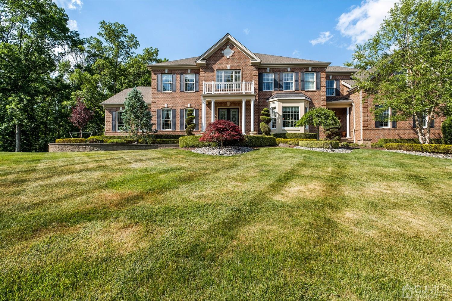 12 Horseshoe Court Monroe Township, NJ 08831 - Photo 47 of 81 a front view of a residential apartment building with a yard
