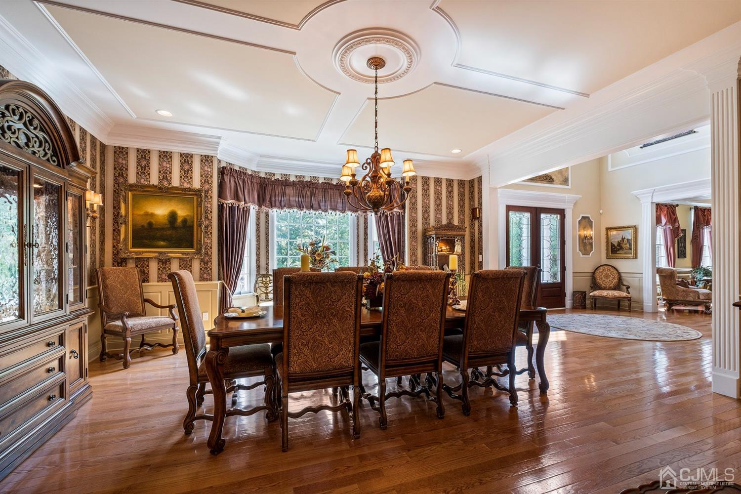 12 Horseshoe Court Monroe Township, NJ 08831 - Photo 69 of 81 a view of a dining room with furniture window and wooden floor