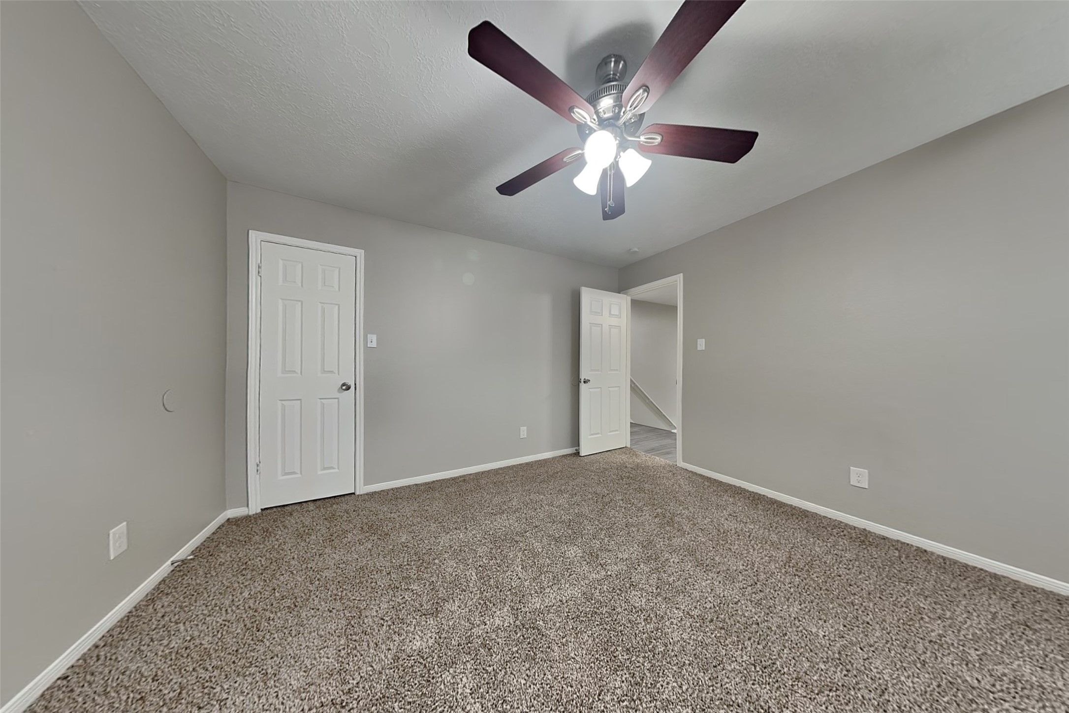 16910 Canyon Laurel Court Spring, TX 77379 - Photo 13 of 21 a view of an empty room with a chandelier fan