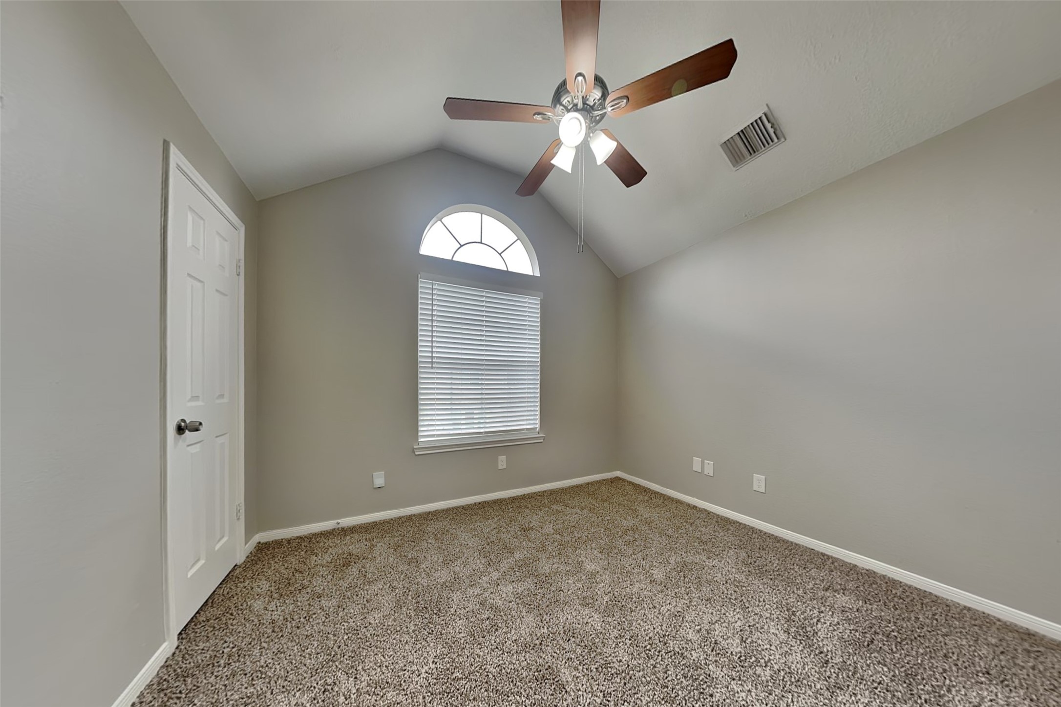 16910 Canyon Laurel Court Spring, TX 77379 - Photo 17 of 21 an empty room with a chandelier fan and windows