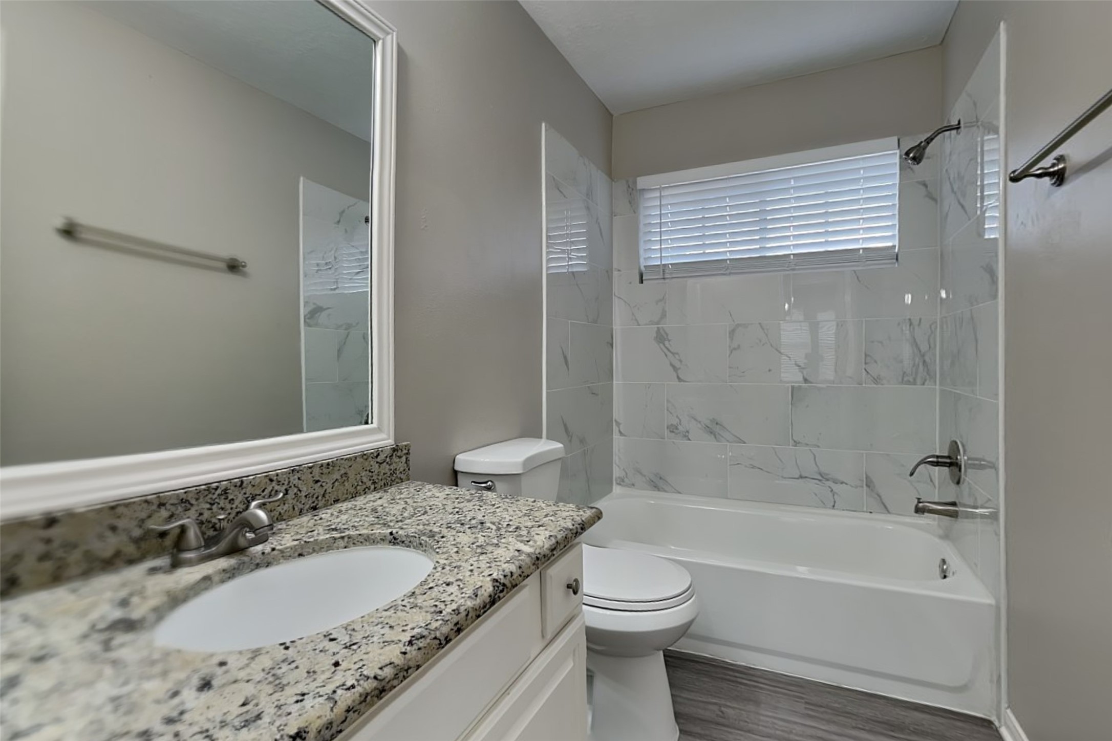 16910 Canyon Laurel Court Spring, TX 77379 - Photo 18 of 21 a bathroom with a granite countertop sink toilet and shower