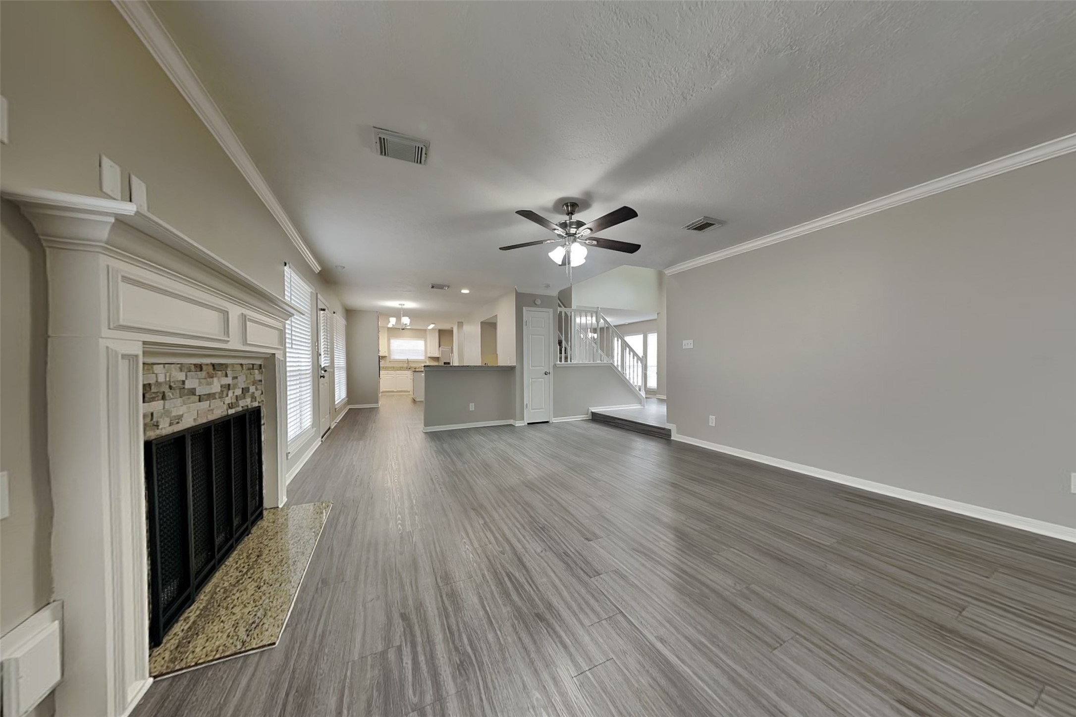 16910 Canyon Laurel Court Spring, TX 77379 - Photo 2 of 21 a view of empty room with wooden floor and fireplace