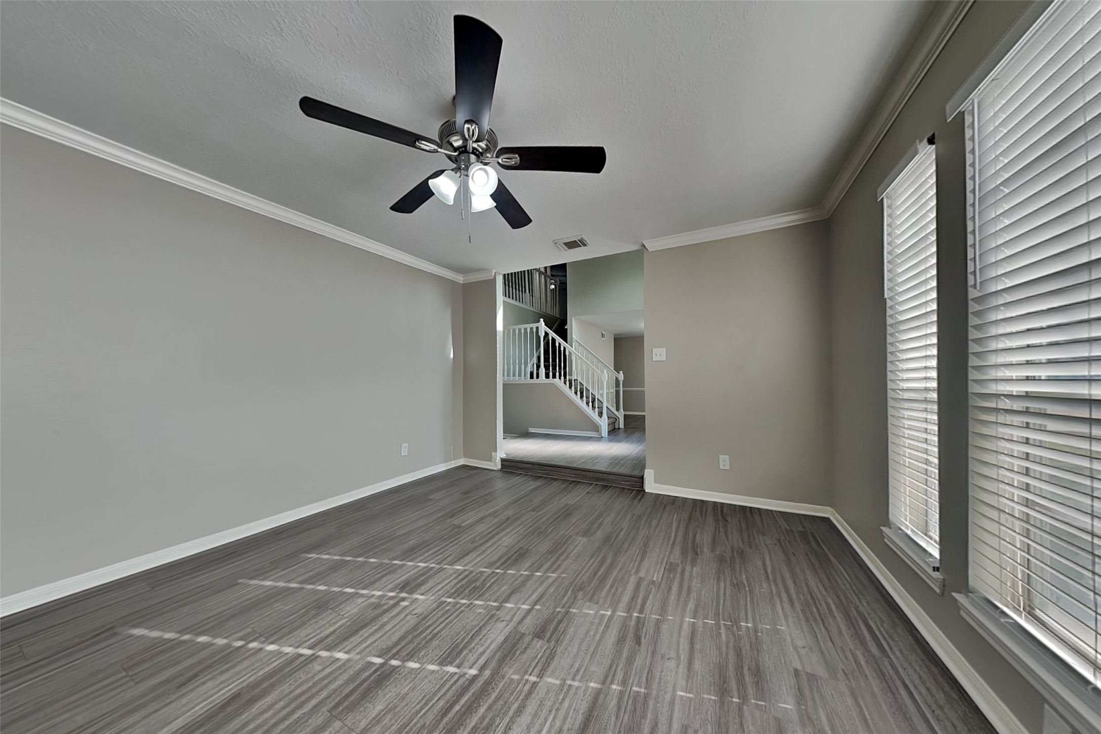 16910 Canyon Laurel Court Spring, TX 77379 - Photo 5 of 21 a view of empty room with wooden floor and fan