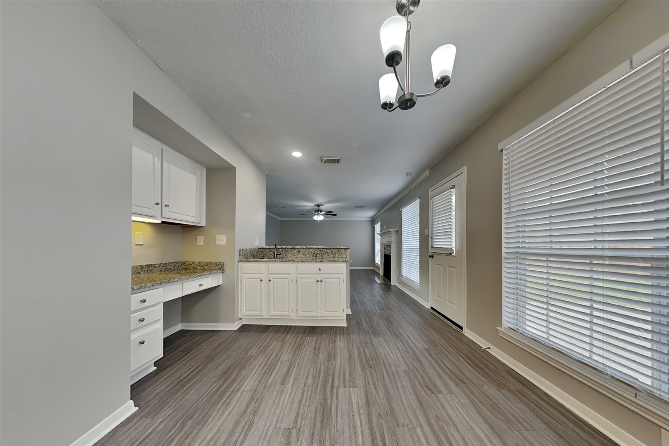 16910 Canyon Laurel Court Spring, TX 77379 - Photo 7 of 21 a large kitchen with a wooden floor and a stove top oven