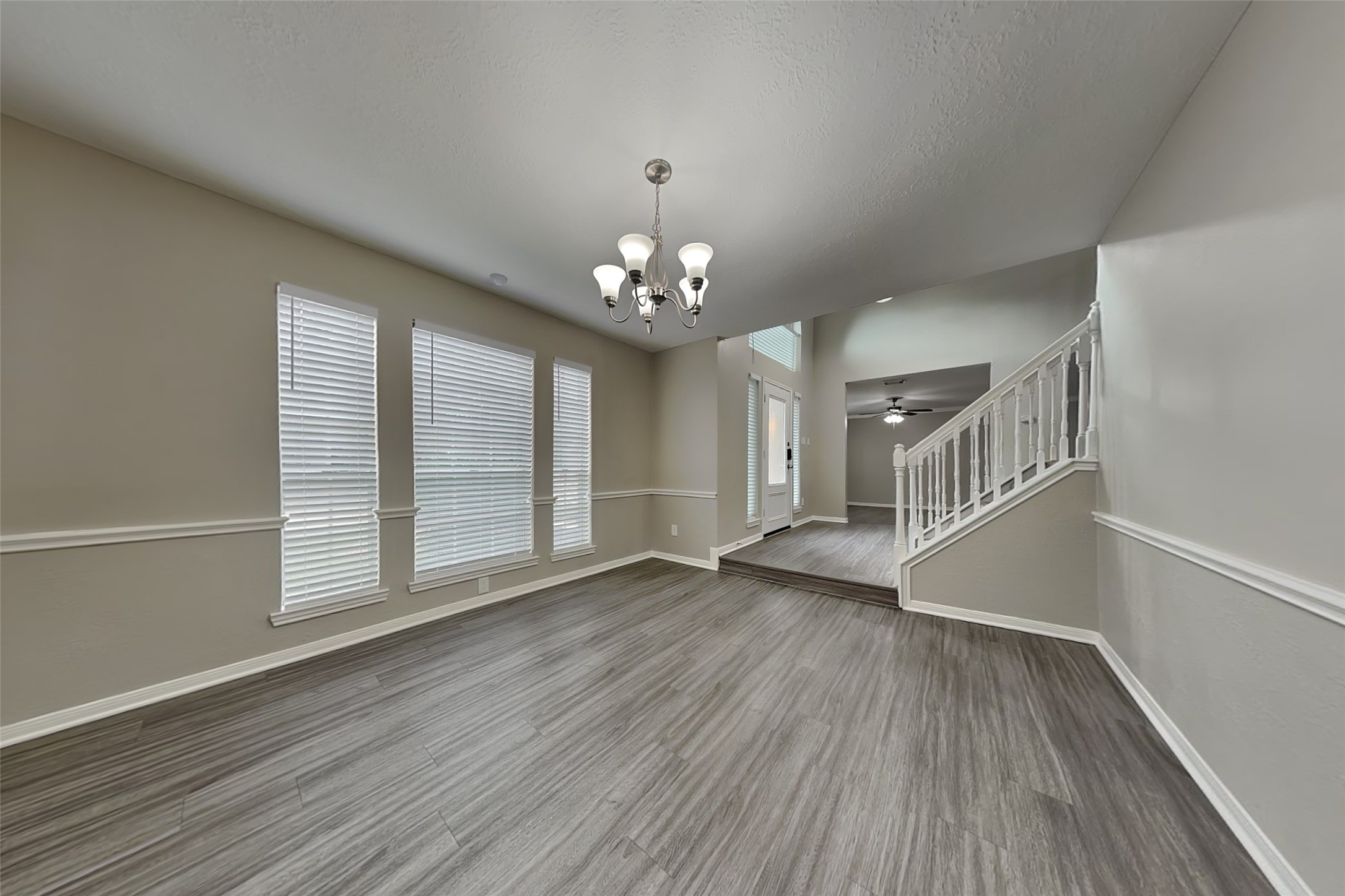 16910 Canyon Laurel Court Spring, TX 77379 - Photo 8 of 21 a view of an empty room with wooden floor and a window