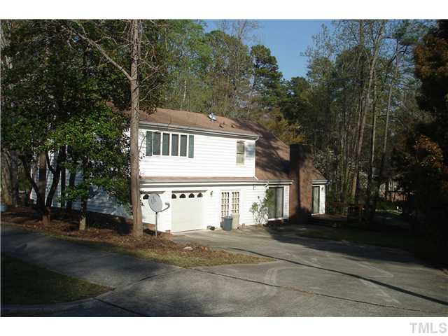 6240 Lookout Loop Raleigh, NC 27612 - Photo 16 of 19 a front view of a house with a yard