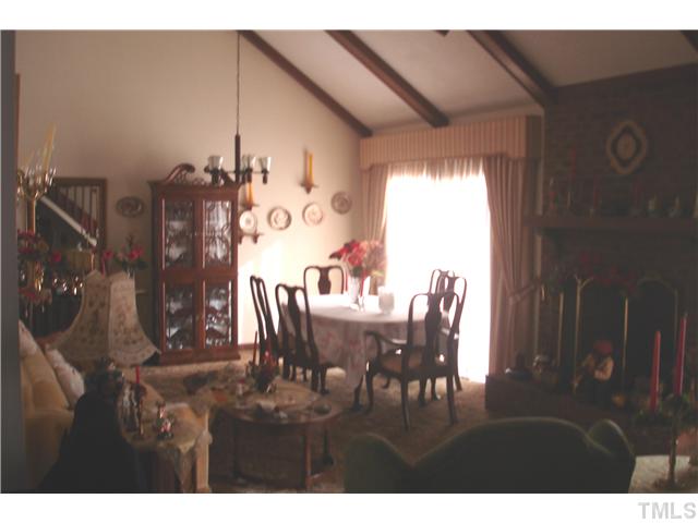 6240 Lookout Loop Raleigh, NC 27612 - Photo 3 of 19 a dining room with furniture and window