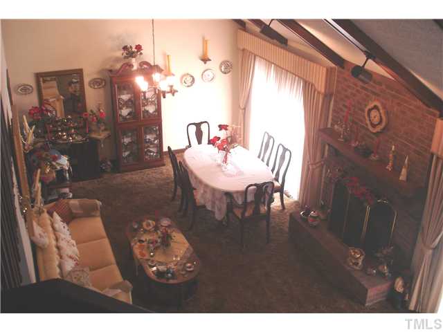 6240 Lookout Loop Raleigh, NC 27612 - Photo 5 of 19 a view of a dining room with furniture and chandelier