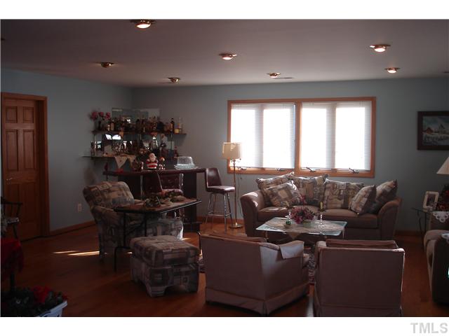 6240 Lookout Loop Raleigh, NC 27612 - Photo 9 of 19 a living room with furniture and a potted plant