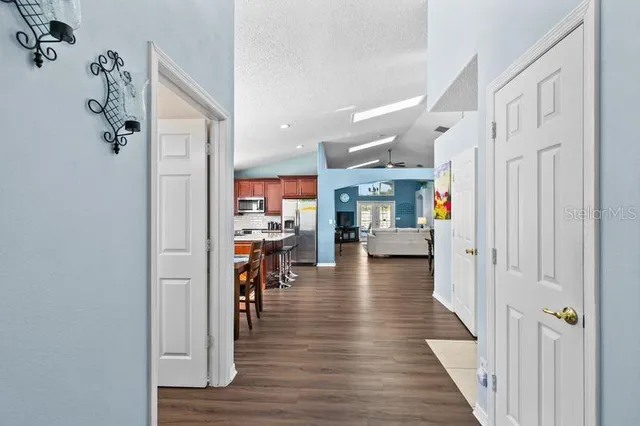 a view of dining room with wooden floor and furniture