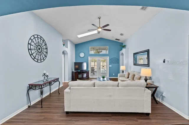 a living room with furniture and a large window