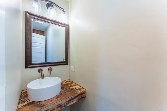 a bathroom with a sink and a mirror