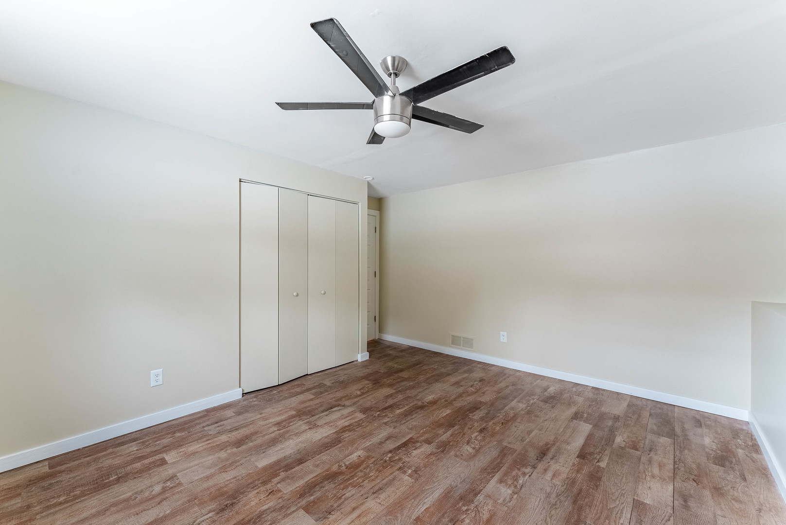 1359 Madison Court St. Charles, IL 60174 - Photo 15 of 23 an empty room with wooden floor and windows