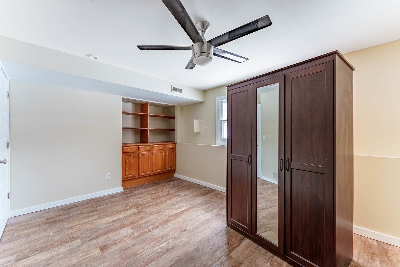 1359 Madison Court St. Charles, IL 60174 - Photo 17 of 23 an empty room with wooden floor closet and windows