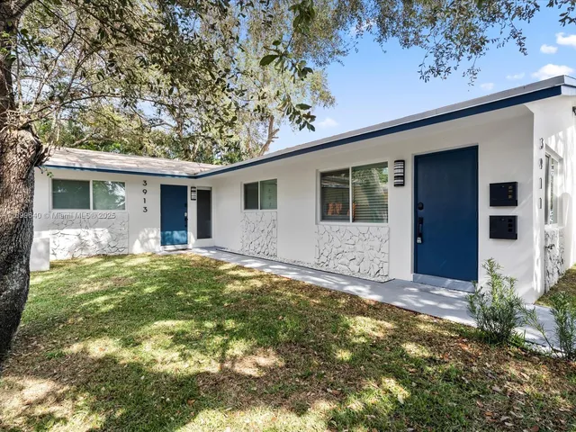 a view of a backyard of the house