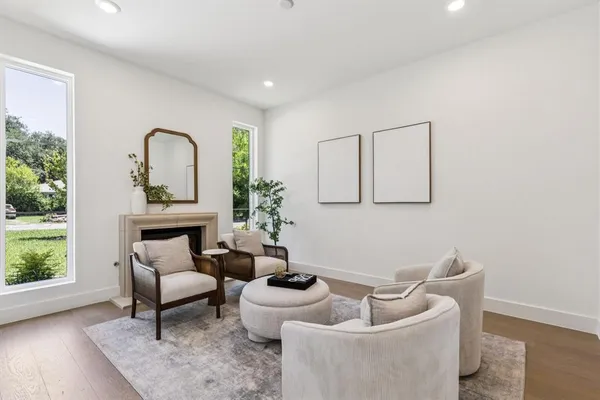 a living room with furniture and a potted plant