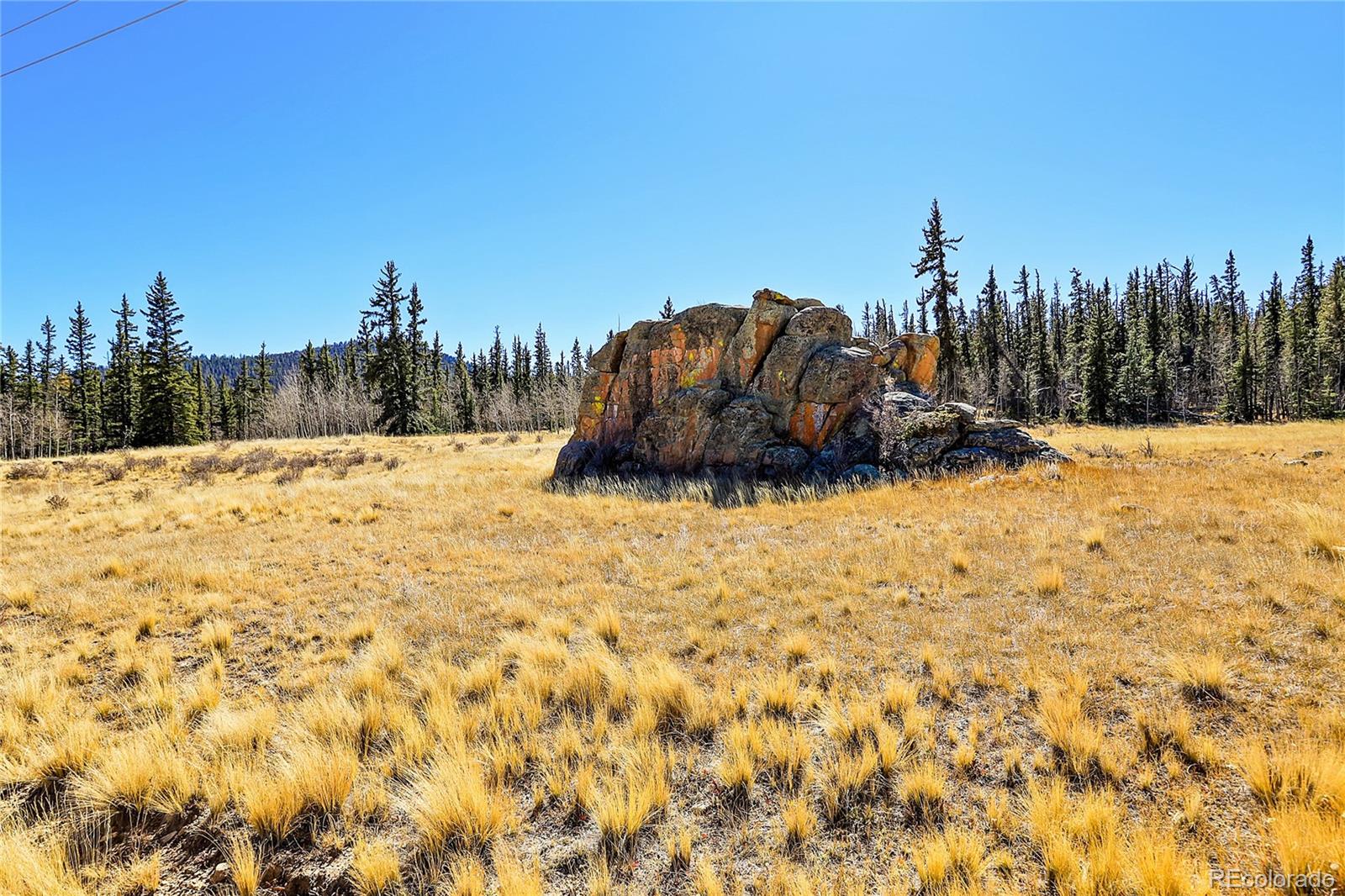778 Chief Trail Como, CO 80456 - Photo 18 of 50 view of a large building with a snow in the background