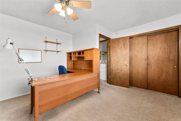 a room with bed and window