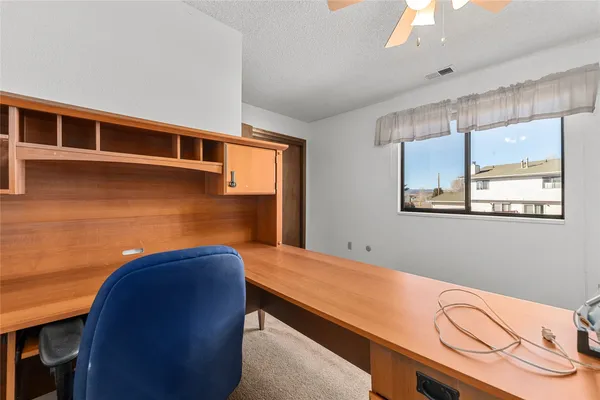 a view of room with window and wooden floor