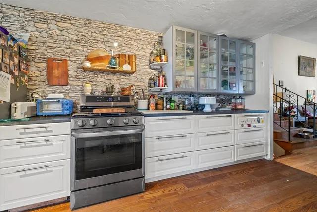 a white toilet sitting next to a shower curtain