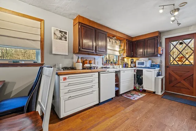 a view of a yard with large trees