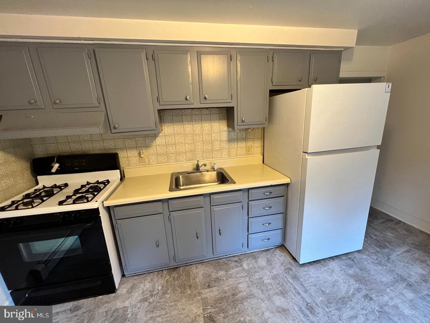 153 New Freedom Road Berlin, NJ 08009 - Photo 13 of 19 a kitchen with sink a refrigerator and cabinets