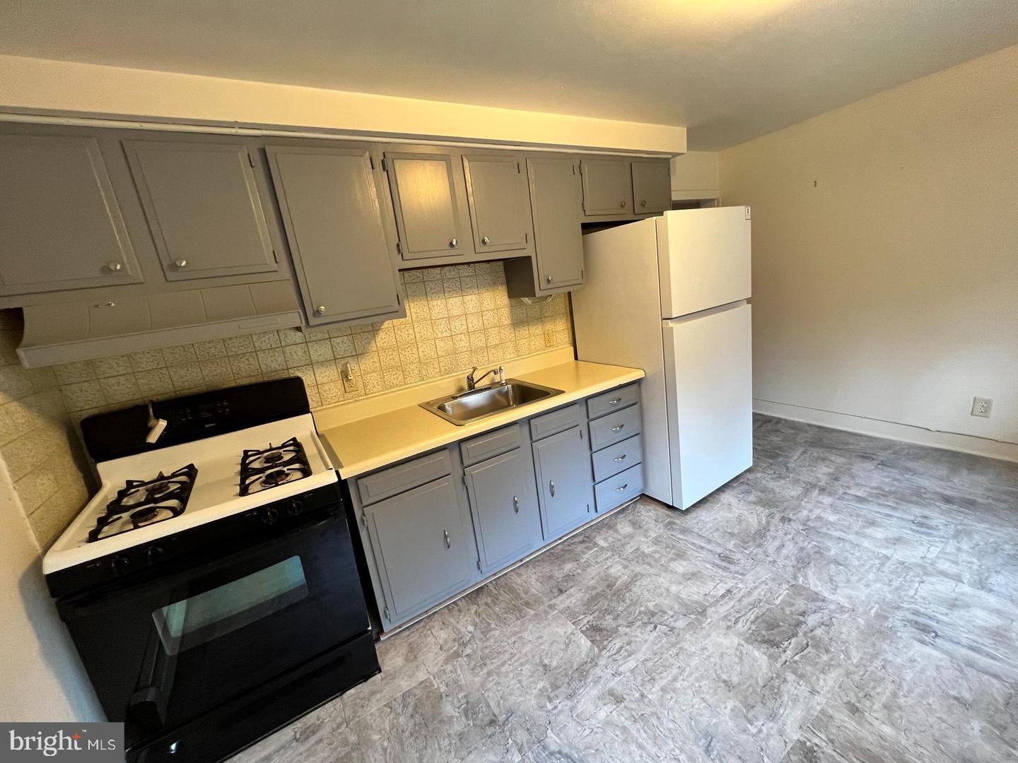 153 New Freedom Road Berlin, NJ 08009 - Photo 5 of 19 a kitchen with cabinets stove and refrigerator