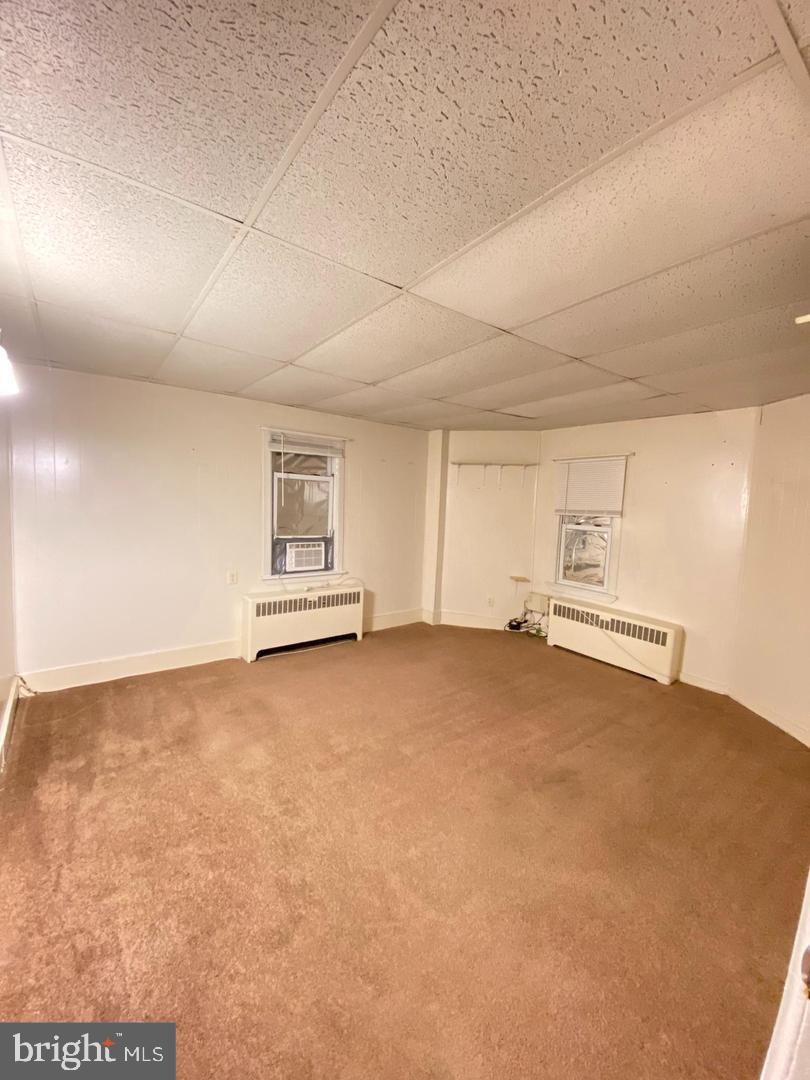 153 New Freedom Road Berlin, NJ 08009 - Photo 8 of 19 an empty room with fire place and windows