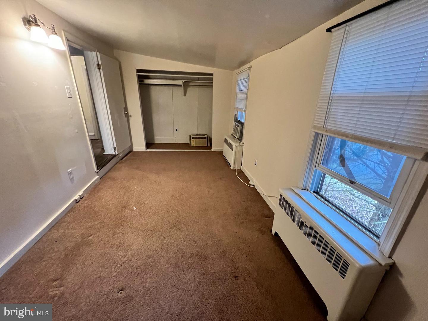 153 New Freedom Road Berlin, NJ 08009 - Photo 10 of 19 a view of an empty room with wooden floor and stairs