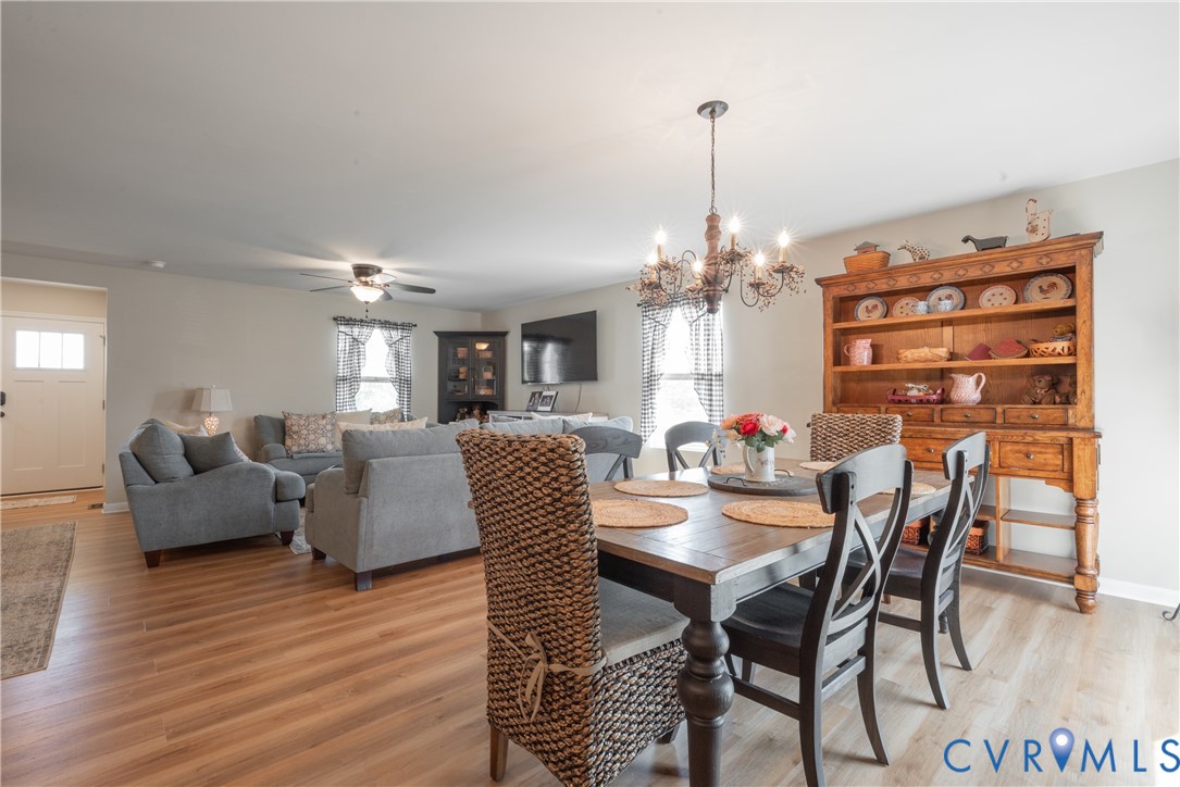 17854 Meriwether Lewis Street Ruther Glen, VA 22546 - Photo 10 of 39 Open-concept living and dining area featuring wood
