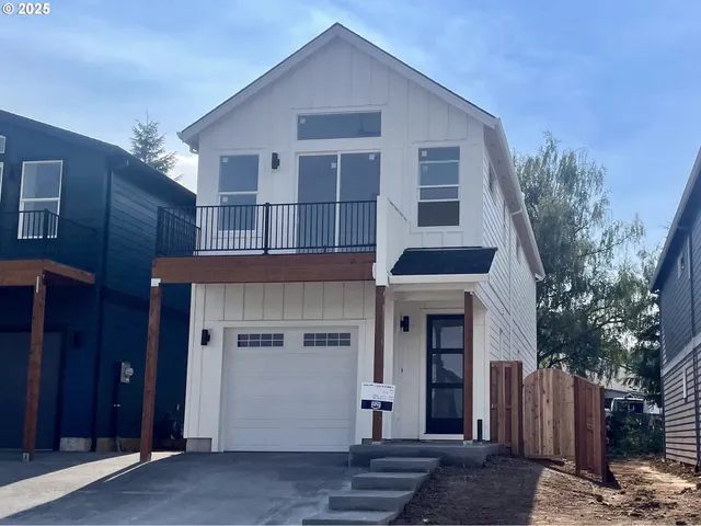 a front view of a house with a garage