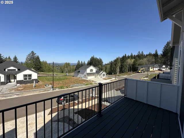 a view of a balcony with wooden floor