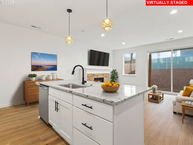 a kitchen with sink and refrigerator