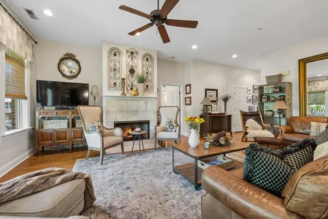 a living room with furniture and a fireplace