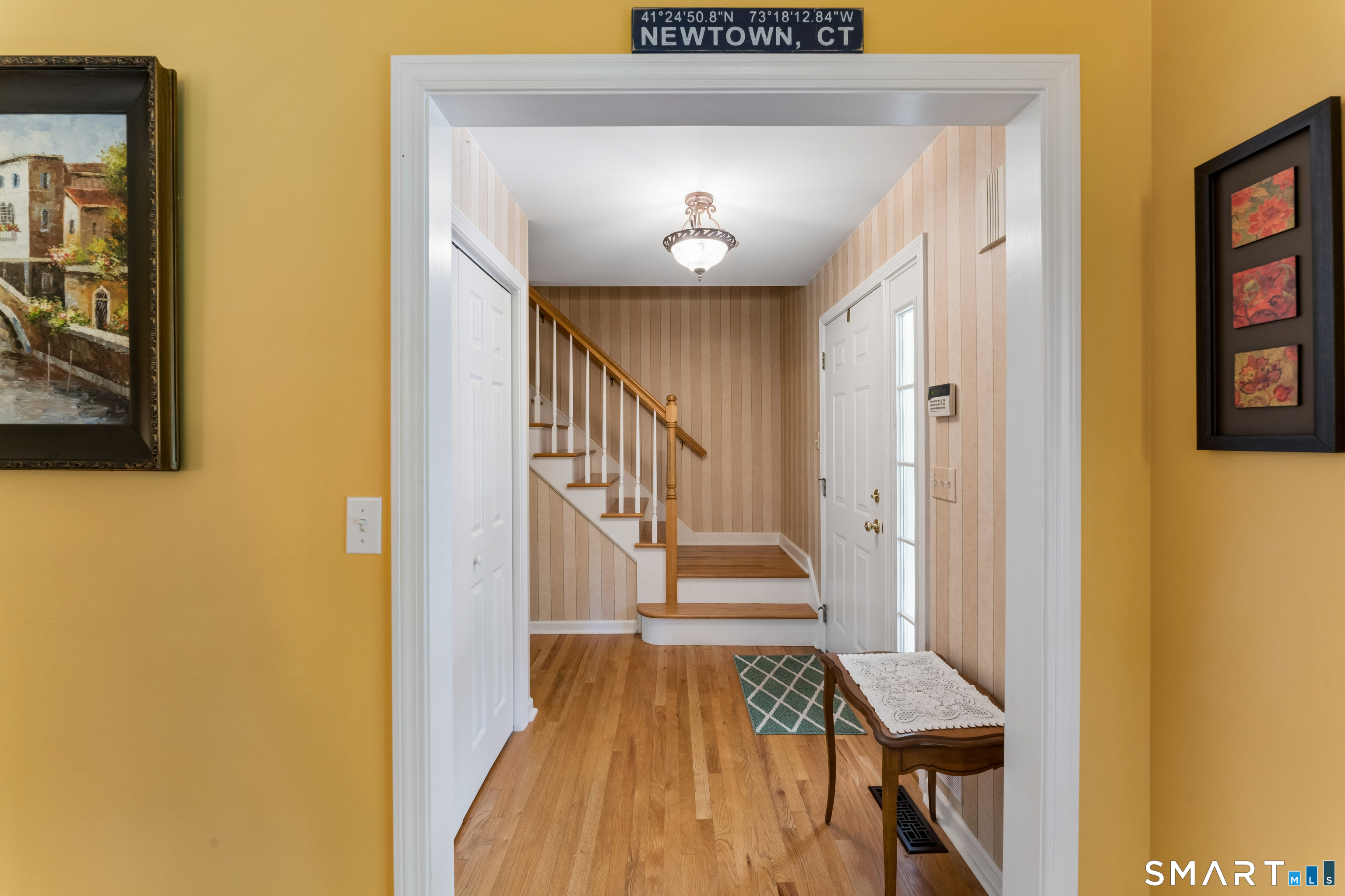 10 Ferris Road Newtown, CT 06470 - Photo 7 of 40 a view of entryway with wooden floor