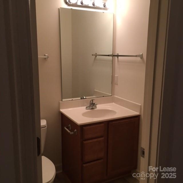 914 D Brawley School Road, Unit D Mooresville, NC 28117 - Photo 7 of 13 a bathroom with a sink toilet and vanity