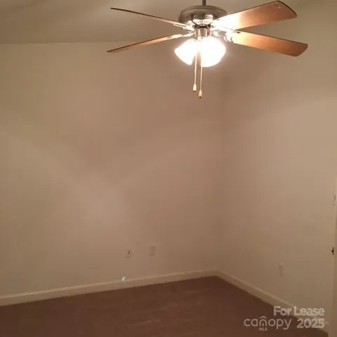 a small space with a fan and a fan