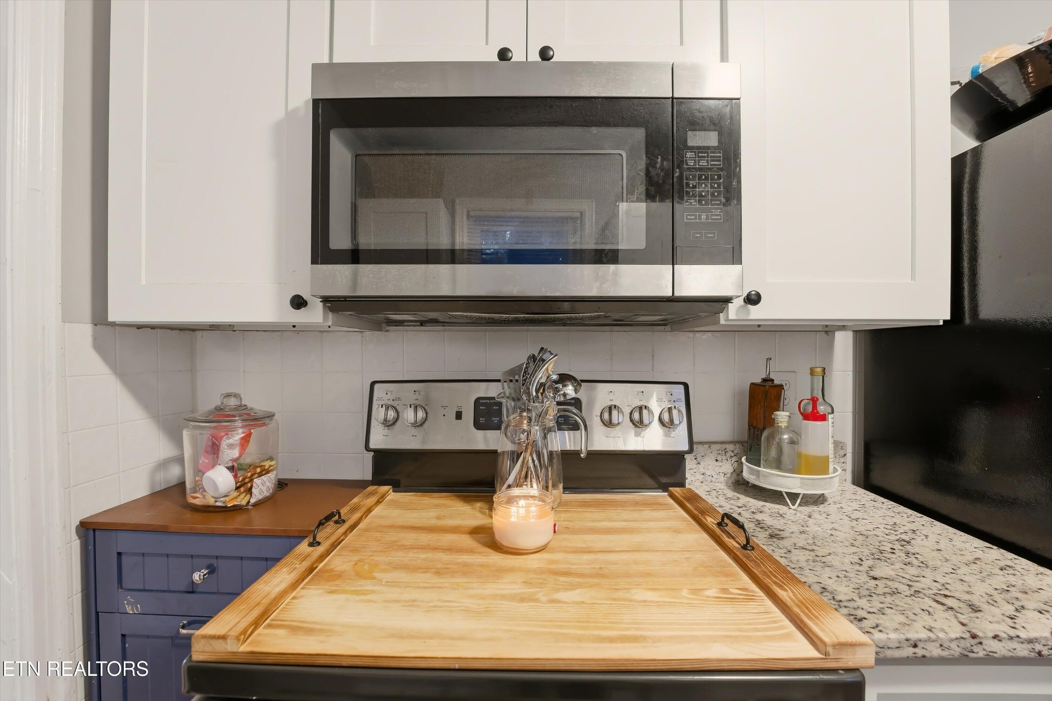1741 North Wright Road Alcoa, TN 37701 - Photo 11 of 31 a kitchen with a stove and cabinets