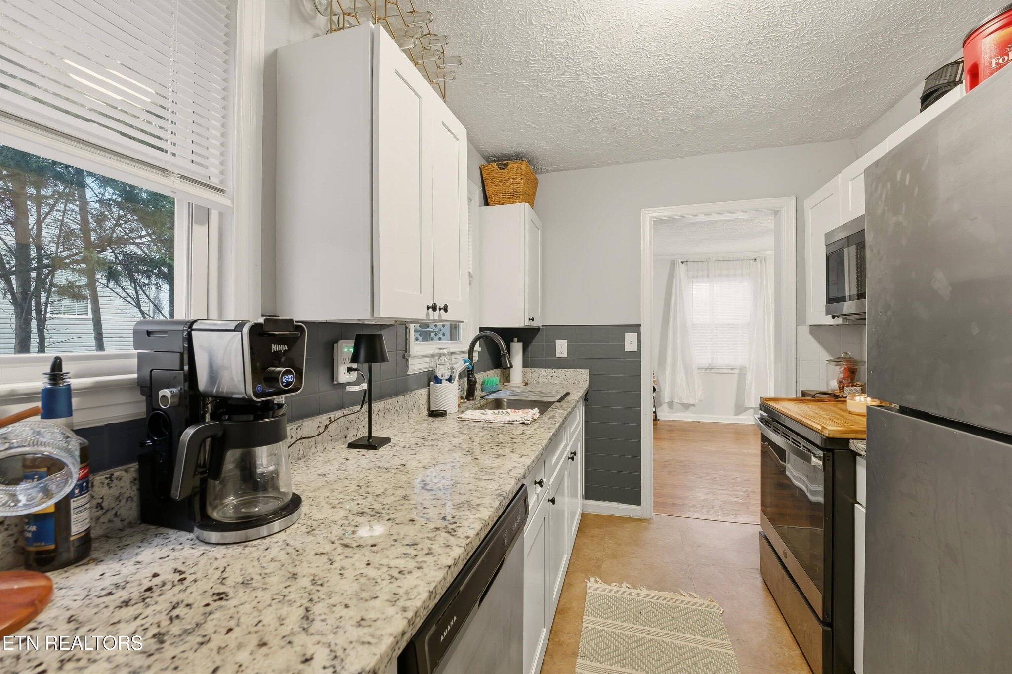 1741 North Wright Road Alcoa, TN 37701 - Photo 13 of 31 a kitchen with granite countertop a sink and a stove top oven