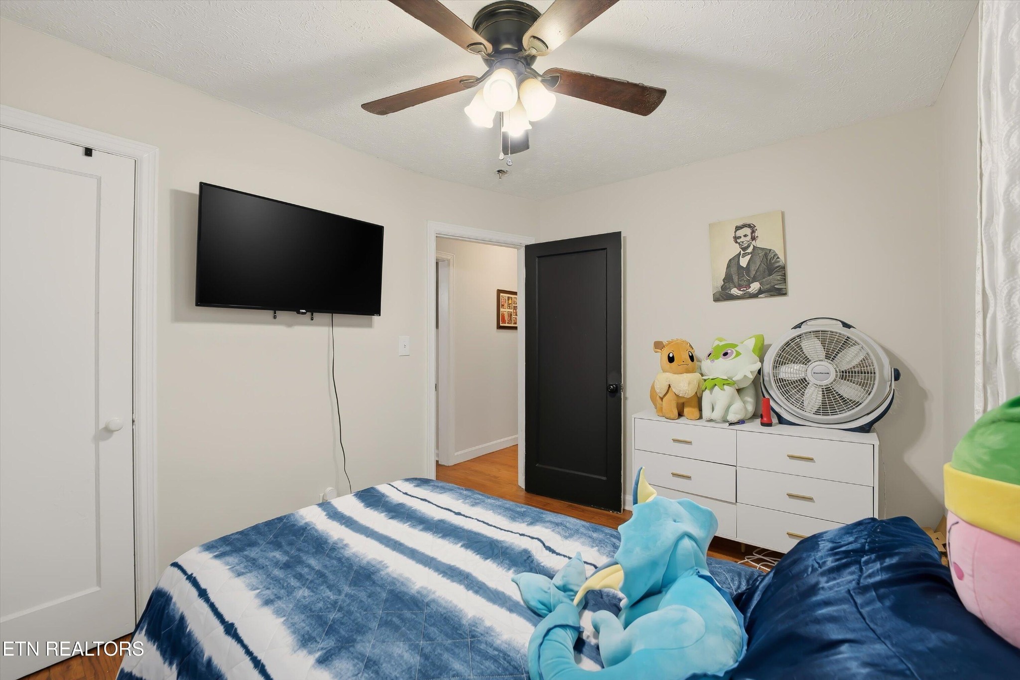 1741 North Wright Road Alcoa, TN 37701 - Photo 18 of 31 a bedroom with a bed and a flat screen tv