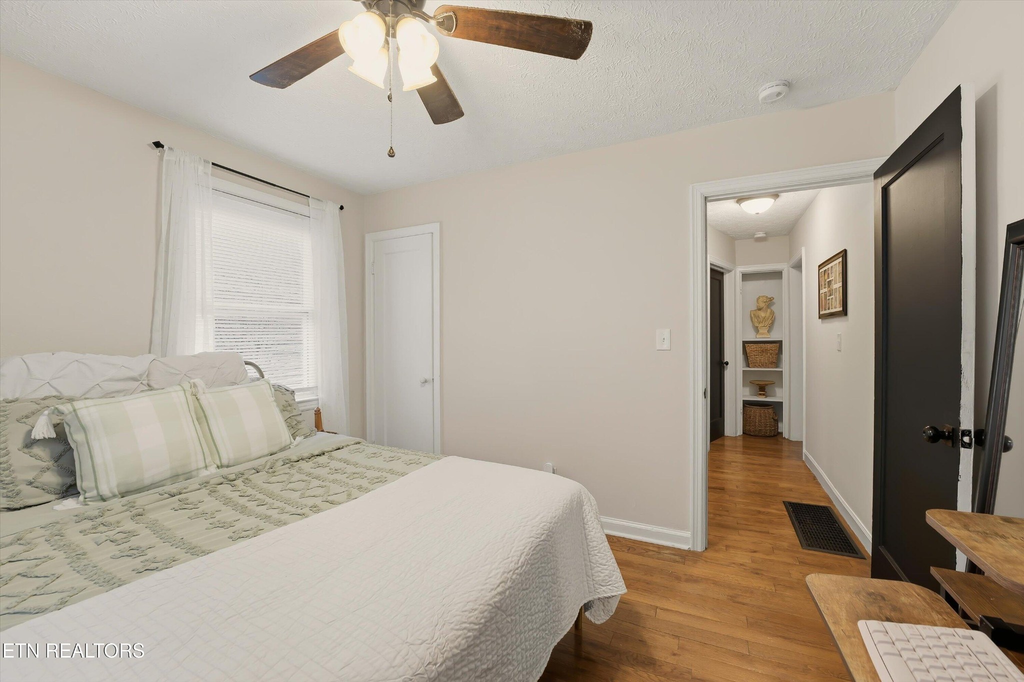 1741 North Wright Road Alcoa, TN 37701 - Photo 20 of 31 a bedroom with a bed and a chandelier