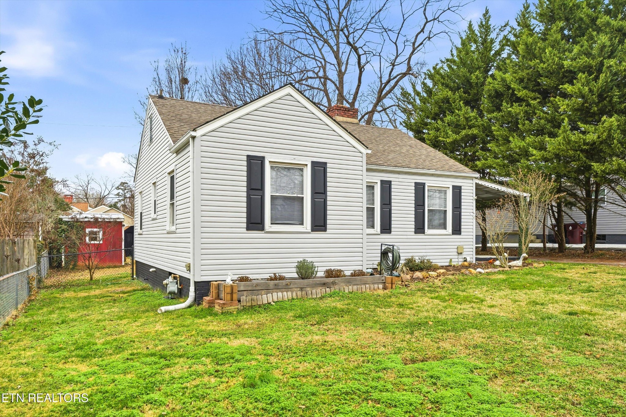1741 North Wright Road Alcoa, TN 37701 - Photo 3 of 31 a front view of house with yard and trees in the background