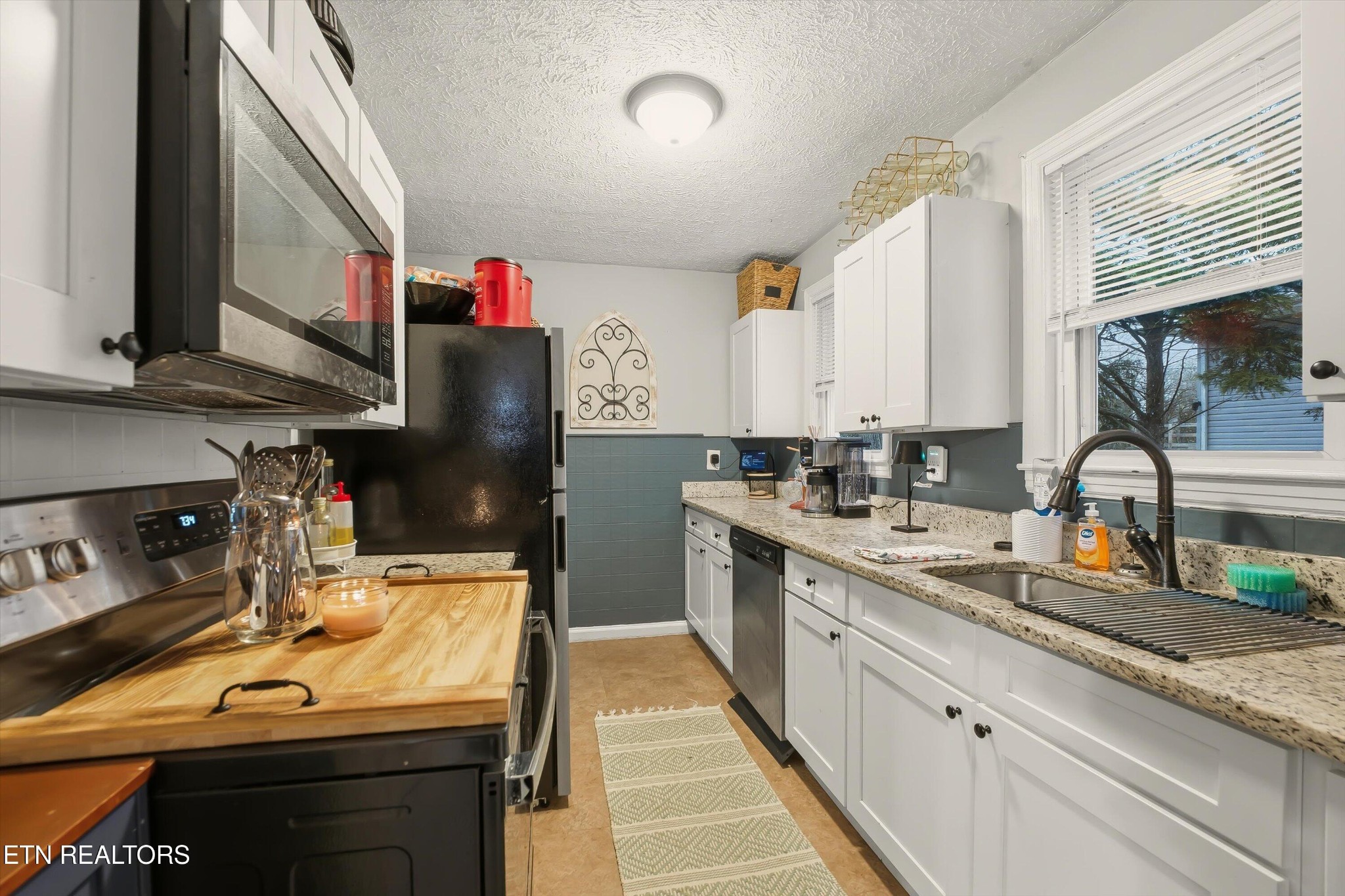 1741 North Wright Road Alcoa, TN 37701 - Photo 10 of 31 a kitchen with a sink stove and cabinets