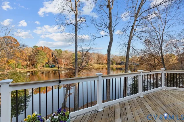 a balcony with wooden floor and city view