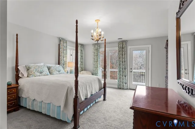 a spacious bedroom with a bed window and walk in closet