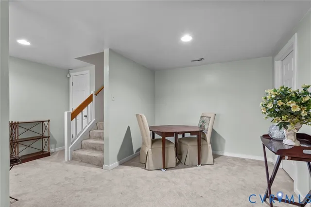 a view of an empty room with stairs