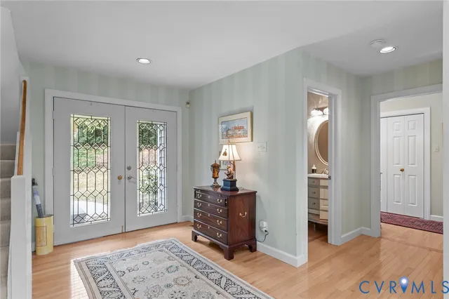 a view of a bedroom with furniture and windows
